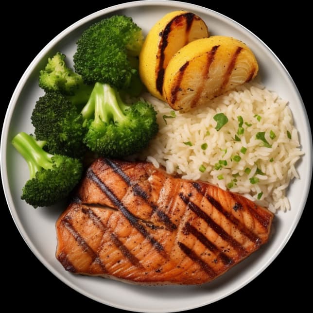 На тарілці лежить апетитна та корисна страва, яка складається з смажений лосось з рисом, броколі та лимонами